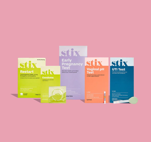 Stix pregnancy, ovulation and UTI test boxes arranged on a pink background.