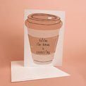 Greeting card illustrated with a takeaway coffee cup reading “Raising Tiny Humans Is Exhausting,” with a white envelope.